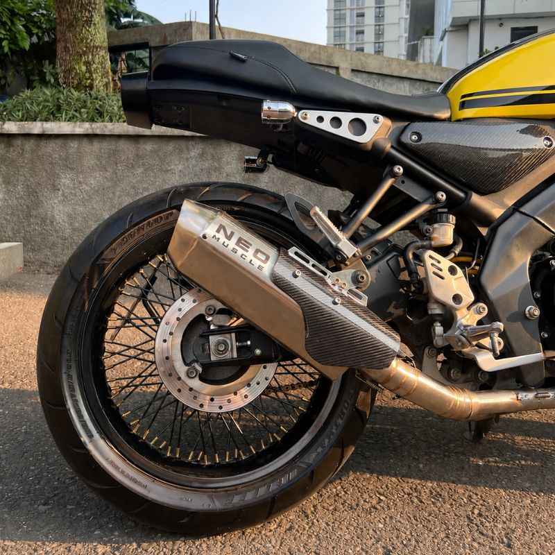 Neo Muscle stainless steel slip-on exhaust installed on Yamaha XSR155 with carbon fiber heat shield