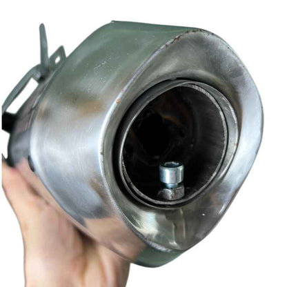 Close-up rear view of Neo Muscle stainless steel DB Killer installed inside Yamaha XSR155 exhaust muffler, showing secure fit and removable sound reduction insert.