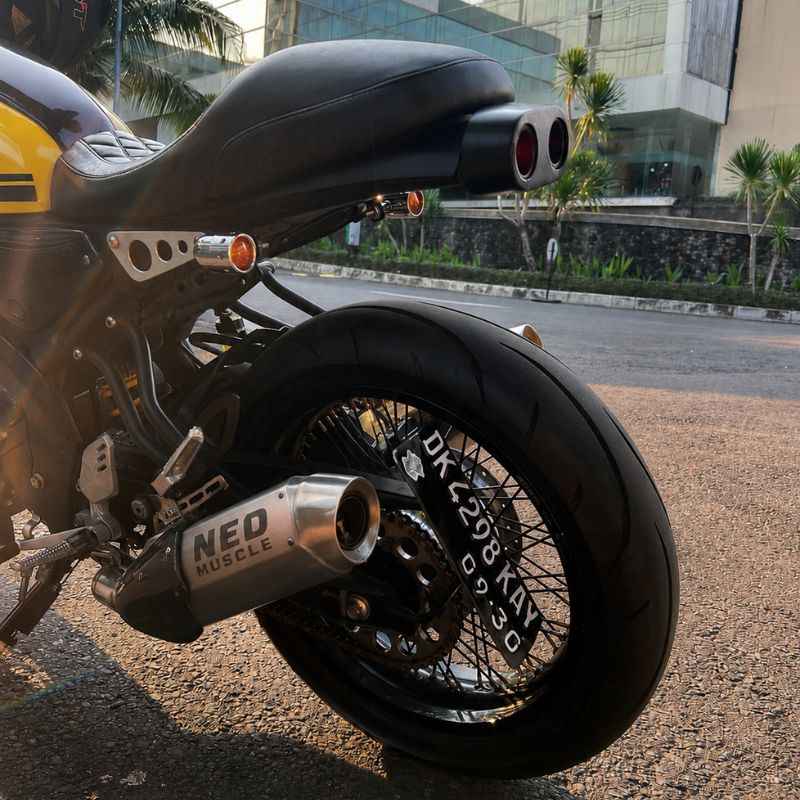 Rear angle view of Yamaha XSR155 with Neo Muscle stainless steel performance exhaust installed