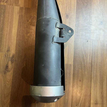 Close-up of the original Yamaha XSR155 OEM exhaust muffler heat shield removed from the Neo Muscle project motorcycle. Genuine factory exhaust in good used condition.
