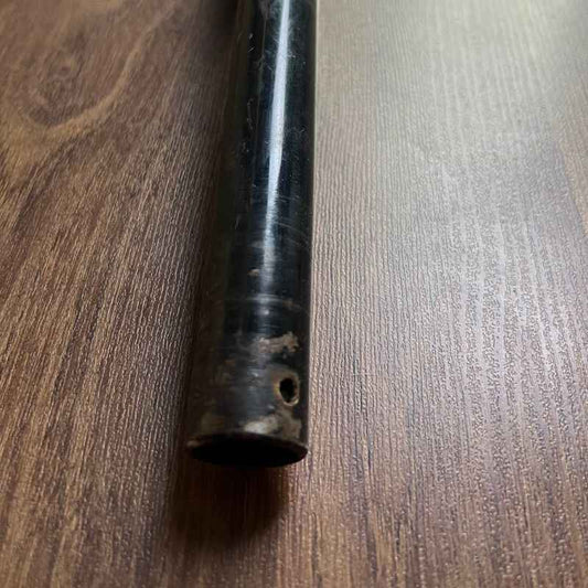 Close-up of the end section of the original Yamaha XSR155 OEM handlebar showing the factory control mounting hole and tube condition. Genuine Yamaha handlebar removed from the Neo Muscle project motorcycle, suitable for OEM replacement or restoration.