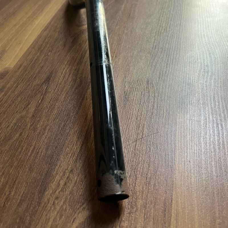 Close-up of the end of the original Yamaha XSR155 OEM handlebar showing normal cosmetic wear from handlebar grips. Genuine Yamaha factory handlebar removed from the Neo Muscle project motorcycle, suitable for OEM replacement or stock restoration.