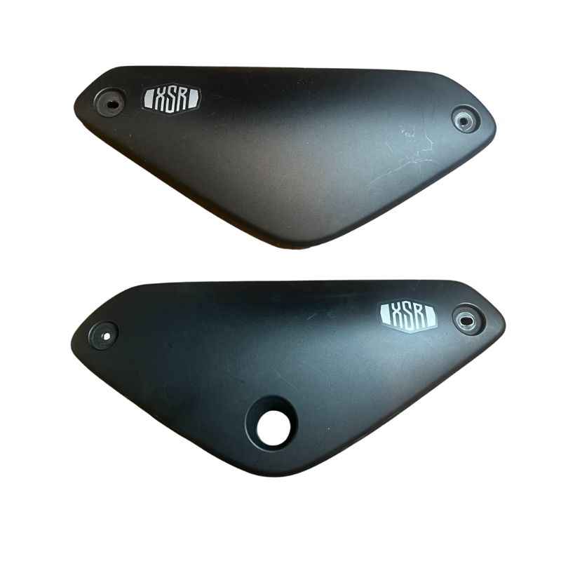 Original Yamaha XSR155 OEM side covers set removed from the Neo Muscle project motorcycle. Genuine factory left and right side panels in good used condition for restoration or replacement.