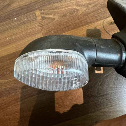 Close-up of the original Yamaha XSR155 OEM rear turn signal mounted on the factory rear fender assembly. Genuine Yamaha indicator with original wiring removed from the Neo Muscle project motorcycle.
