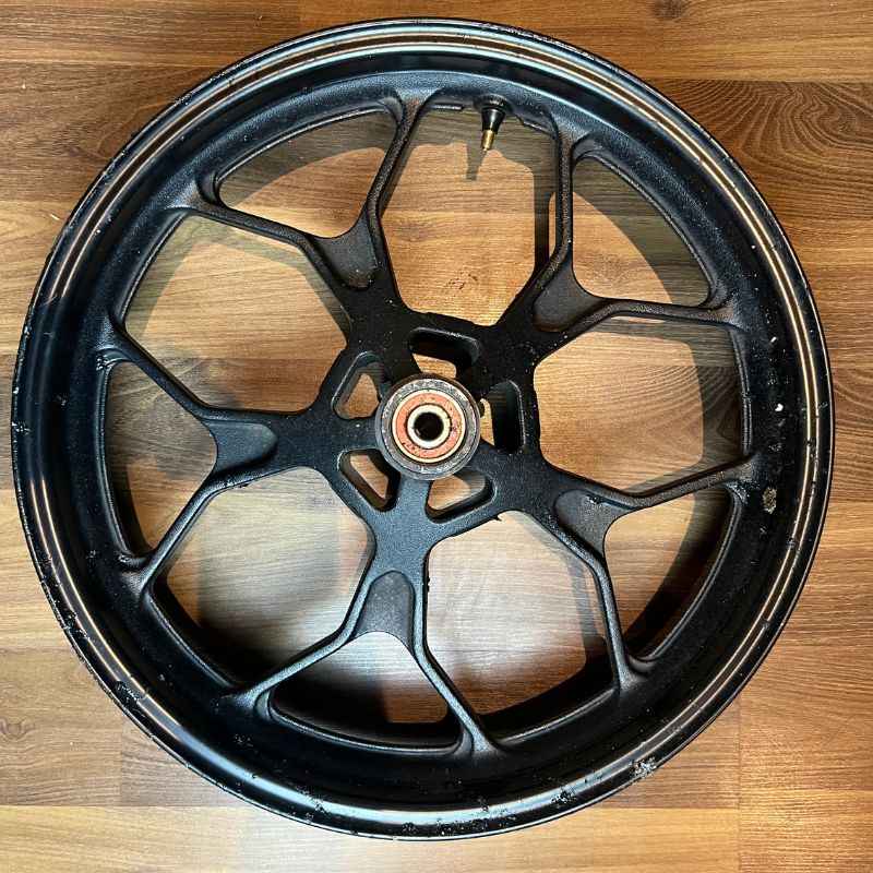 Original Yamaha XSR155 OEM rear wheel (velg) removed from the Neo Muscle project motorcycle. Genuine factory rear wheel in original condition.